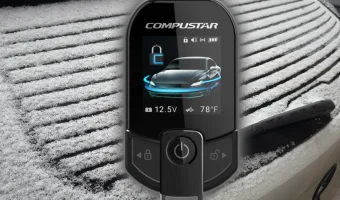 The Compustar T13 Remote Starter hovering in the air in front of a car with snow all over it