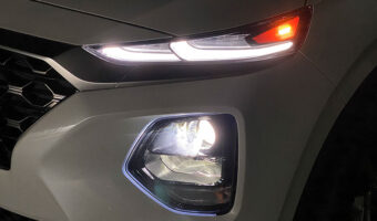 Headlights on a white vehicle