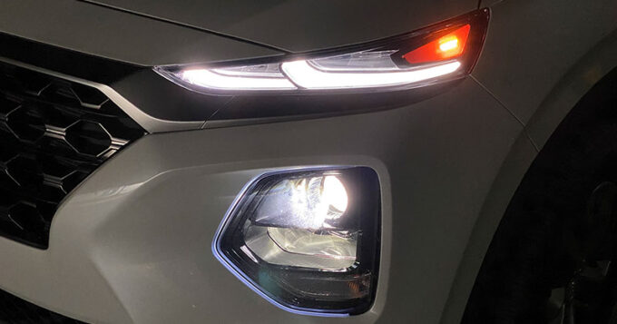 Headlights on a white vehicle