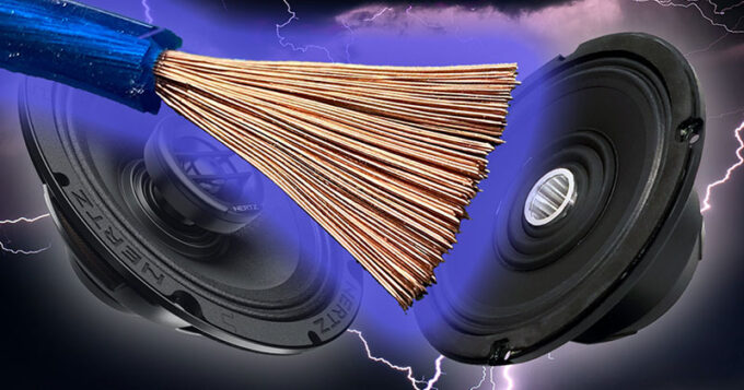 Two car audio speakers and an exposed wire cable