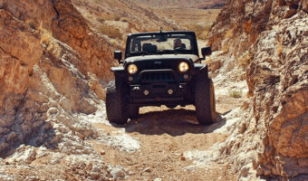 A jeep going off-road on a canyon