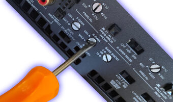 A car audio amplifier being set