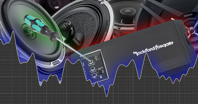 An assortment of car audio equipment and a screwdriver