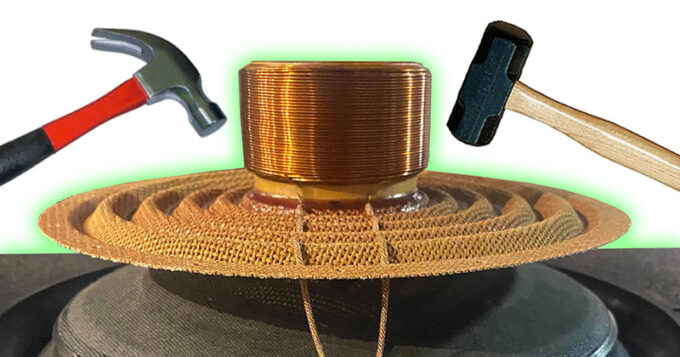 A hammer and a mallet one on each side of the inside of a car audio speaker sound coil