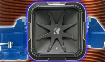 A subwoofer box in a vice