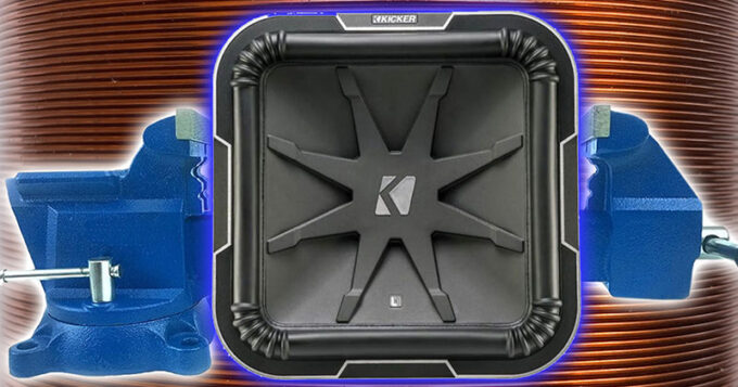 A subwoofer box in a vice